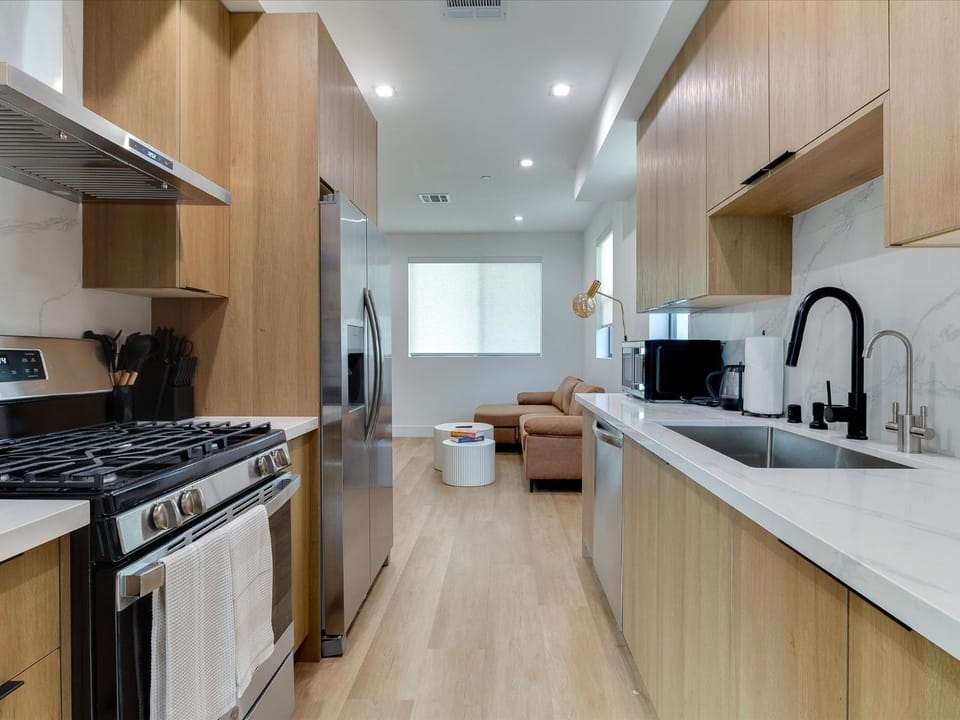 Kitchen or kitchenette, dishwasher, oven, stove