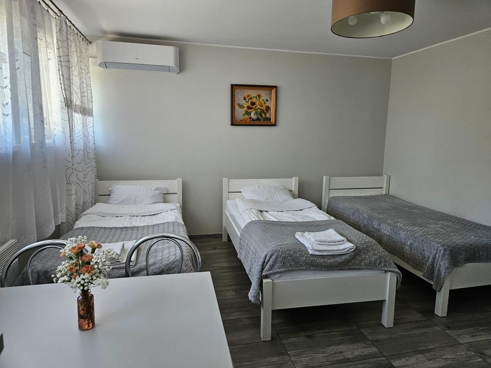 Bed, Other, Other, Other, Photo of the whole room, Decorative detail, Decorative detail, Seating area, Bedroom, towels, towels, air conditioner