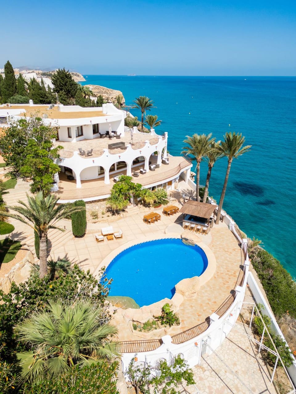 Property building, Nearby landmark, Day, Natural landscape, Beach, Pool view, Sea view, Swimming pool, sunbed