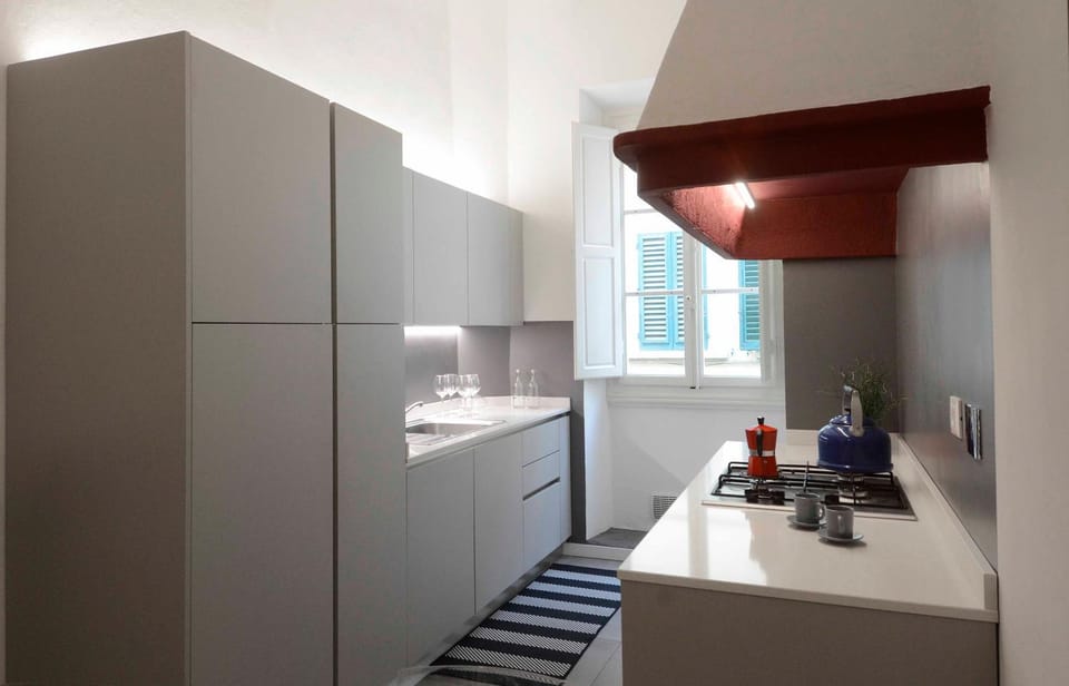 Kitchen or kitchenette, dishwasher, oven, stove, air conditioner