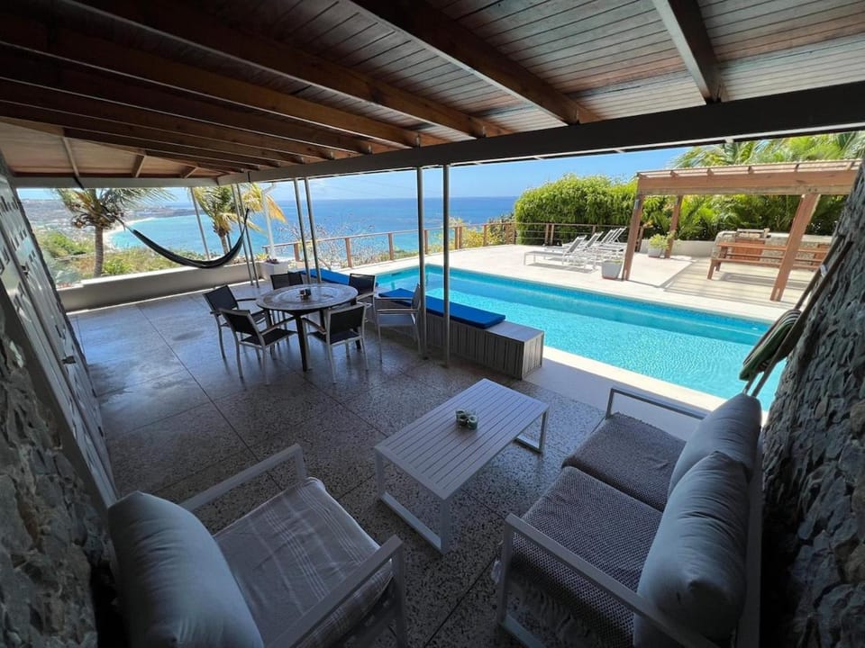Patio, Seating area, Sea view, Swimming pool