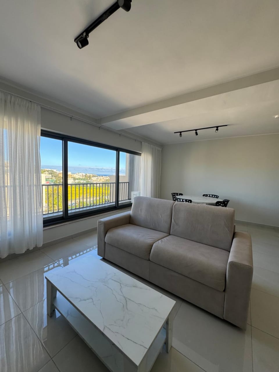 View (from property/room), Living room, Seating area, City view, Sea view