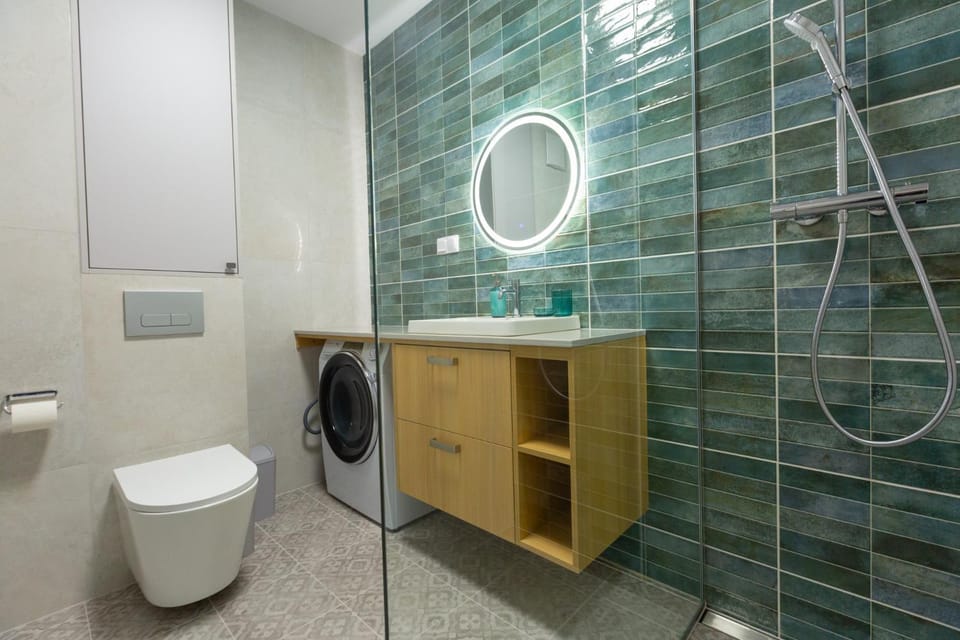 Shower, Toilet, Bathroom, towels, washing machine, dryer