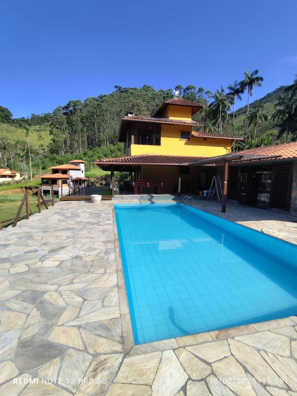 Property building, Day, Natural landscape, Mountain view, Pool view, Swimming pool, sunbed