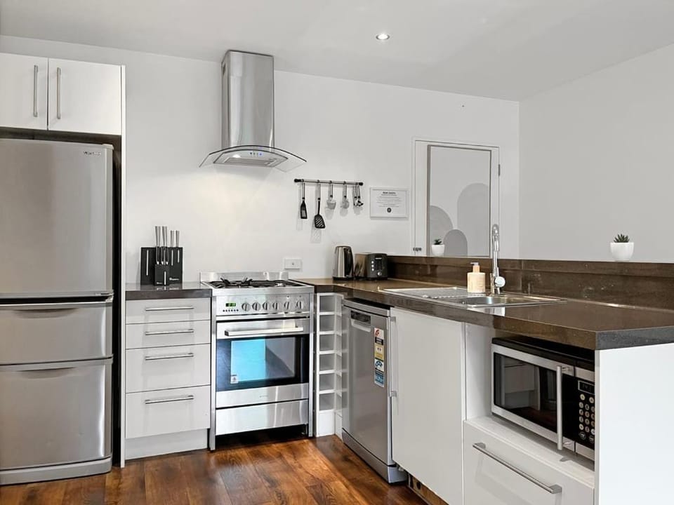 Kitchen or kitchenette, dishwasher, microwave, stove, kitchen
