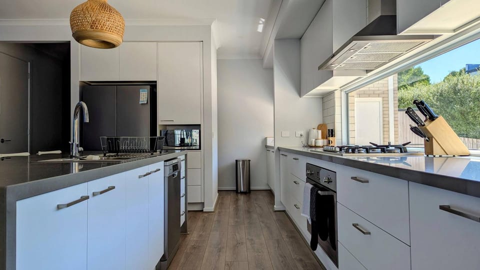 Kitchen or kitchenette, dishwasher, oven, stove