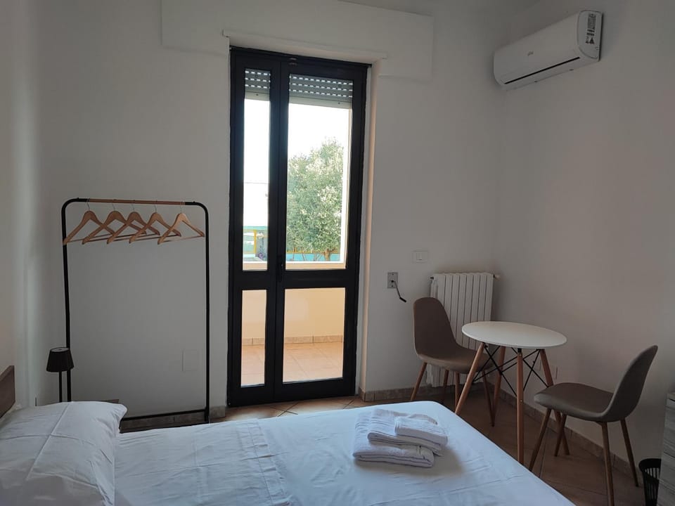 Bed, Photo of the whole room, Bedroom, towels, air conditioner