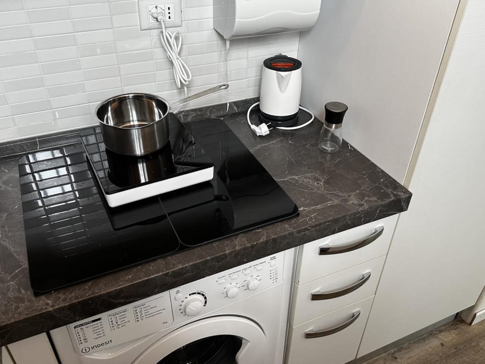 Kitchen or kitchenette, stove, washing machine