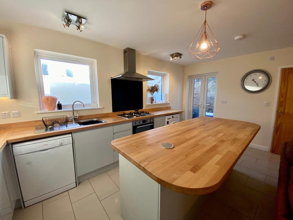 Kitchen or kitchenette, dishwasher, oven, stove