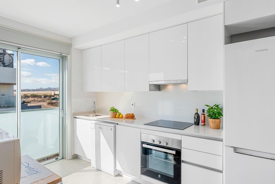 Kitchen or kitchenette, dishwasher, oven, stove