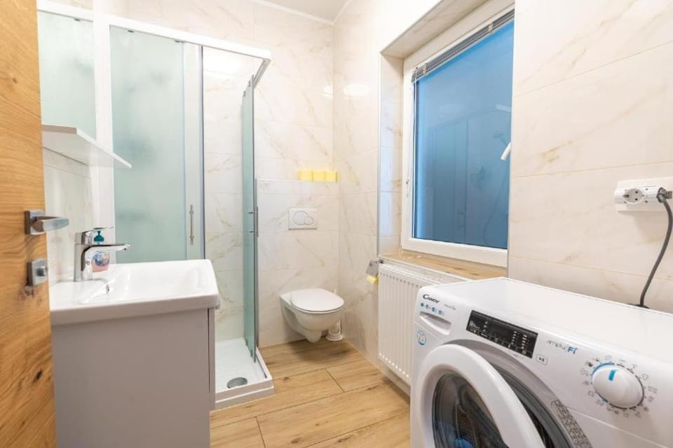 Shower, Toilet, Bathroom, towels, washing machine, dryer