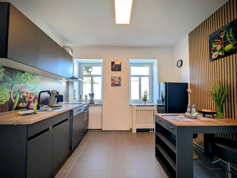 Kitchen or kitchenette, dishwasher, oven, stove, toaster