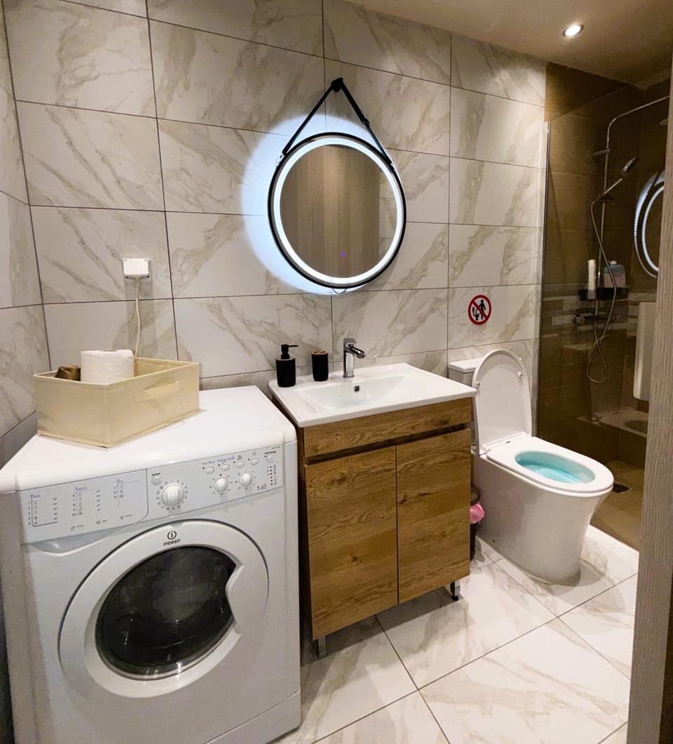 Shower, Toilet, Bathroom, towels, washing machine, dryer