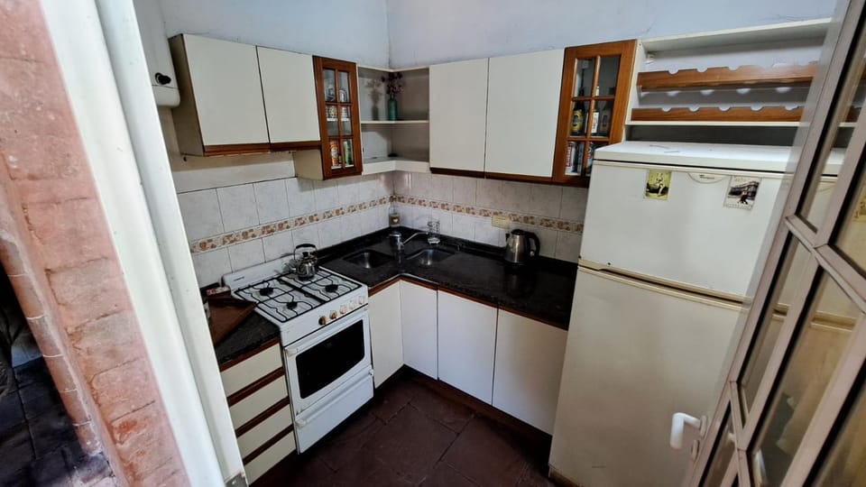 Kitchen or kitchenette, dishwasher, oven, stove