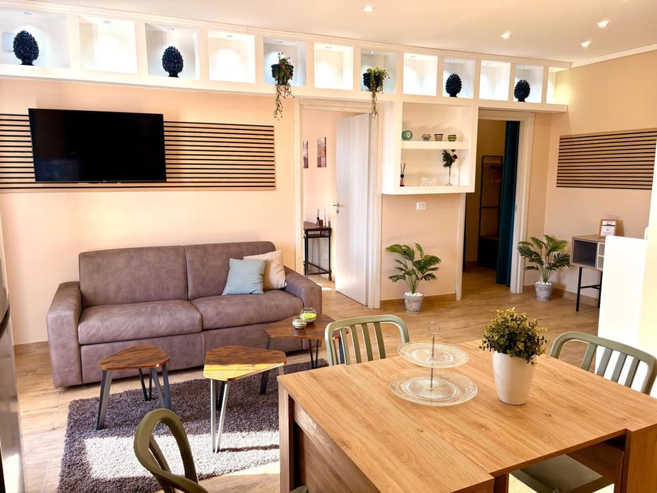 Communal lounge/ TV room, Property logo or sign, TV and multimedia, Balcony/Terrace, Kitchen or kitchenette, Living room, Photo of the whole room, Seating area, Dining area, group of guests, furniture, heating, internet, air conditioner