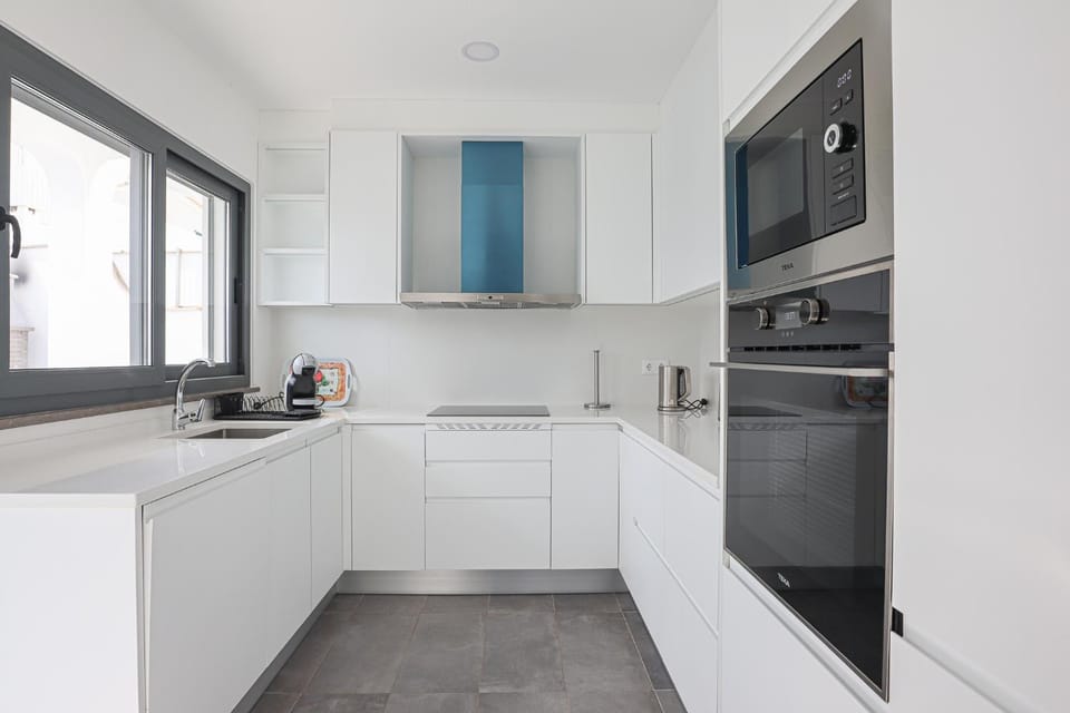 Kitchen or kitchenette, dishwasher, oven, stove, toaster