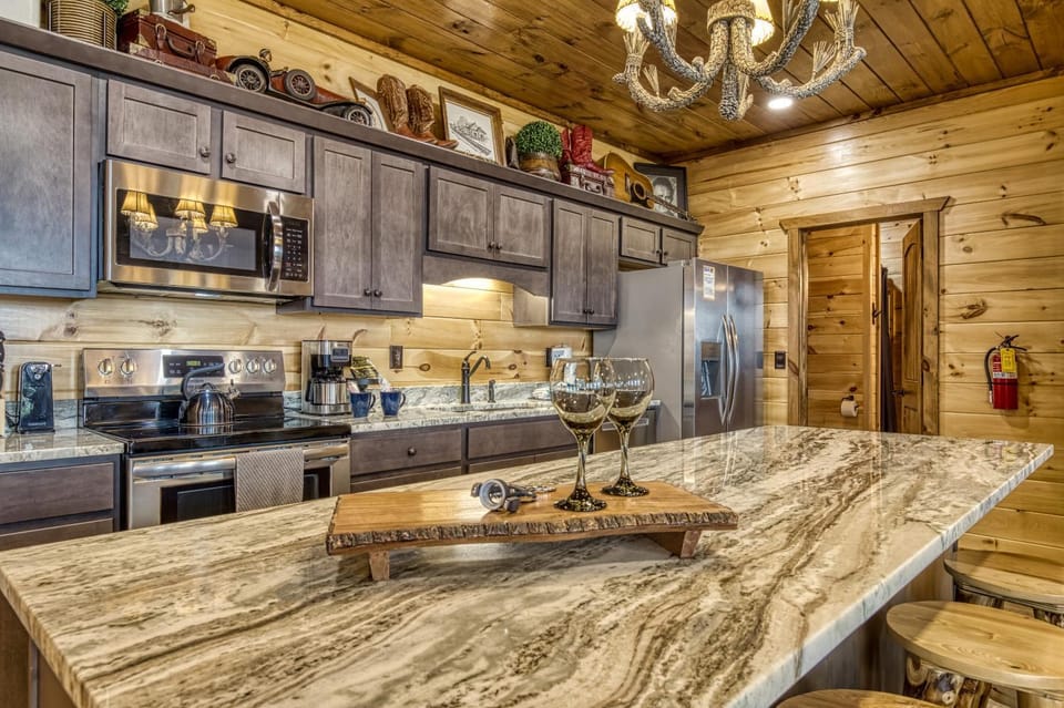 Kitchen or kitchenette, dishwasher, microwave, oven, stove