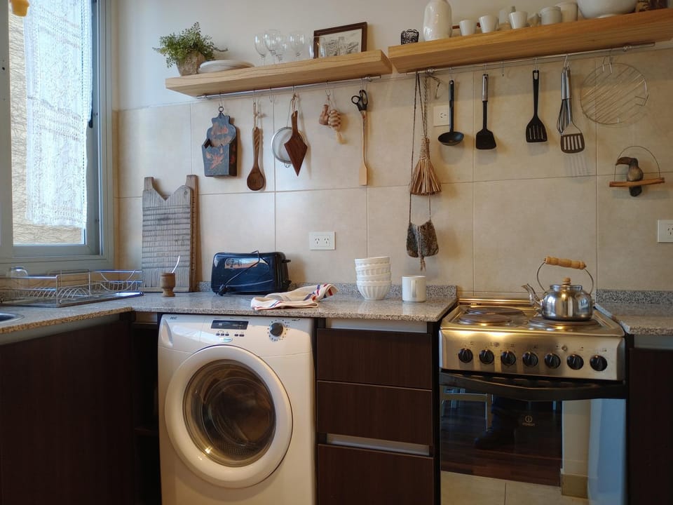 Kitchen or kitchenette, stove, toaster, washing machine