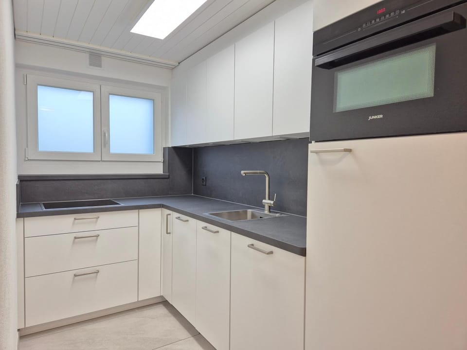 Kitchen or kitchenette, dishwasher, laundry, washing machine, dryer
