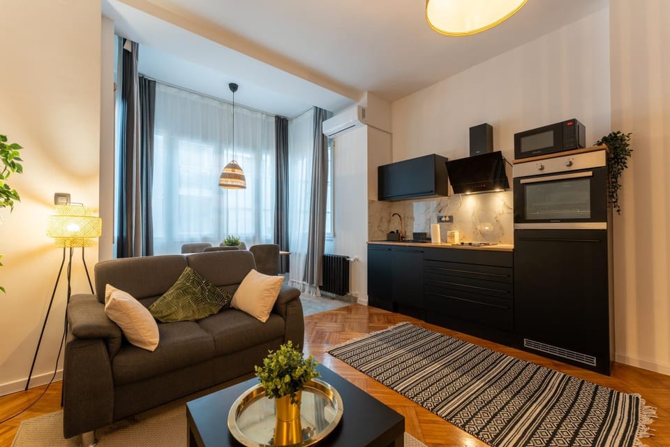 Living room, Seating area, Dining area, microwave, oven, stove, air conditioner