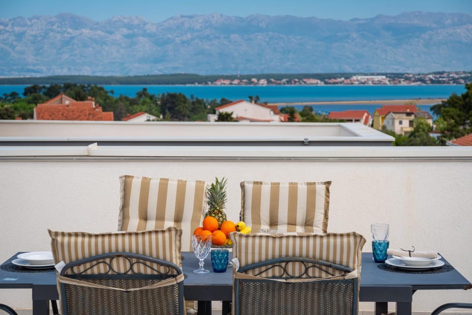 View (from property/room), Balcony/Terrace, Seating area, Mountain view, Sea view