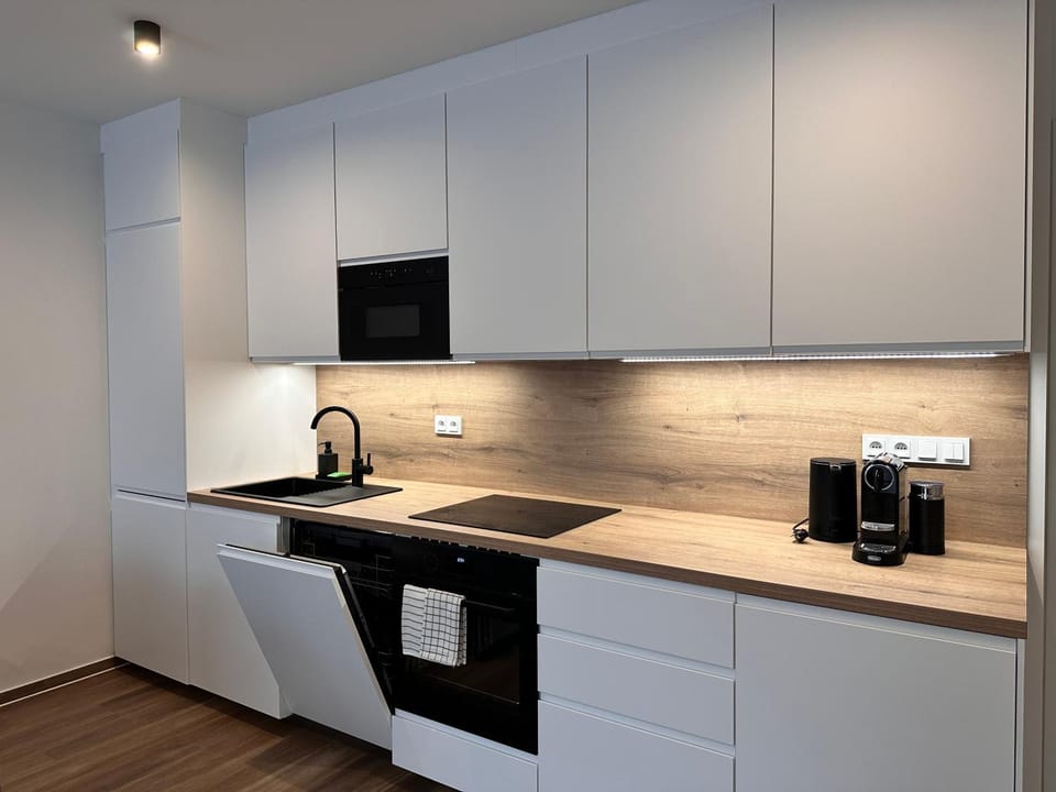 Kitchen or kitchenette, dishwasher, microwave, oven