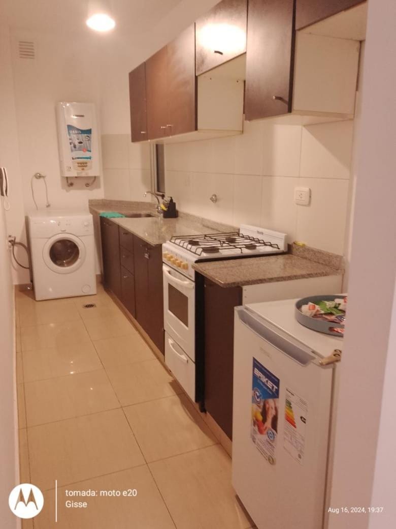 Kitchen or kitchenette, oven, stove, washing machine