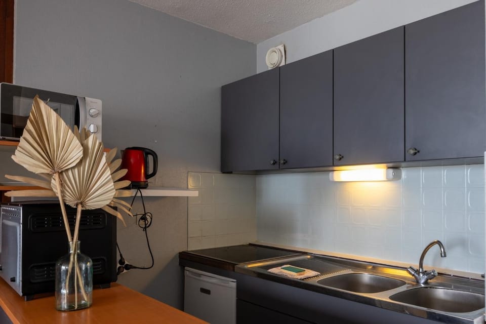 Kitchen or kitchenette, stove
