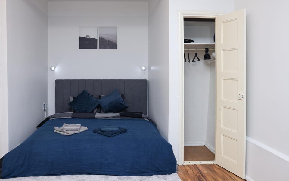 Bed, towels, wardrobe