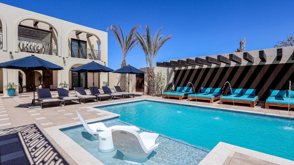 Property building, Patio, Pool view, Swimming pool, sunbed