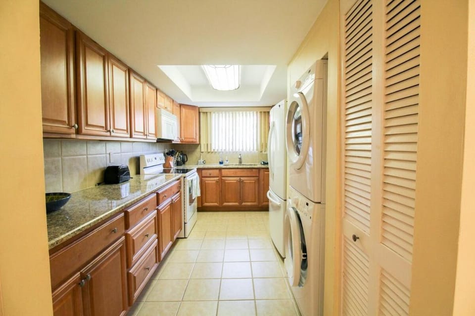 Kitchen or kitchenette, dishwasher, oven, washing machine, dryer