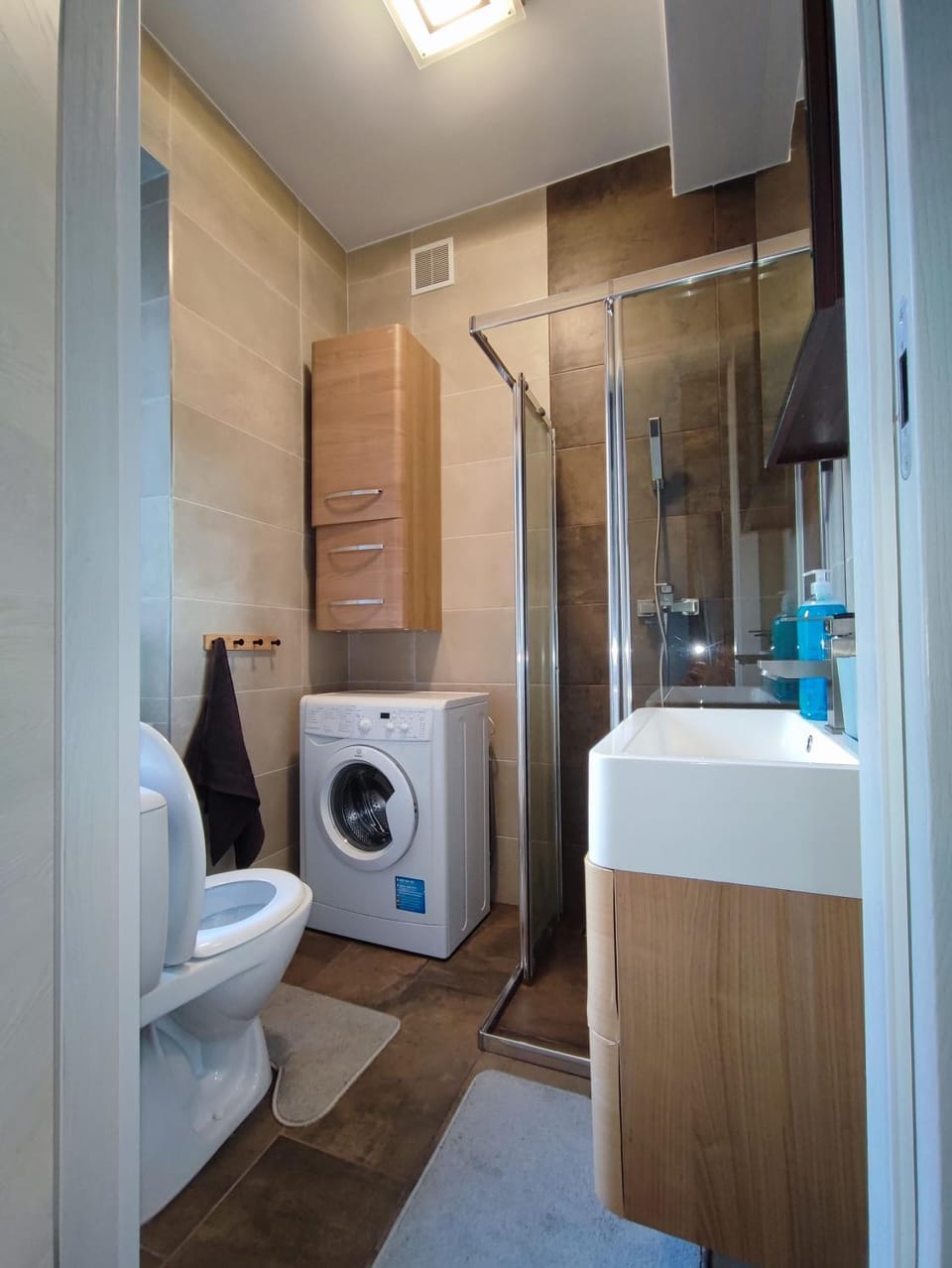 Shower, Toilet, Bathroom, towels, washing machine, dryer