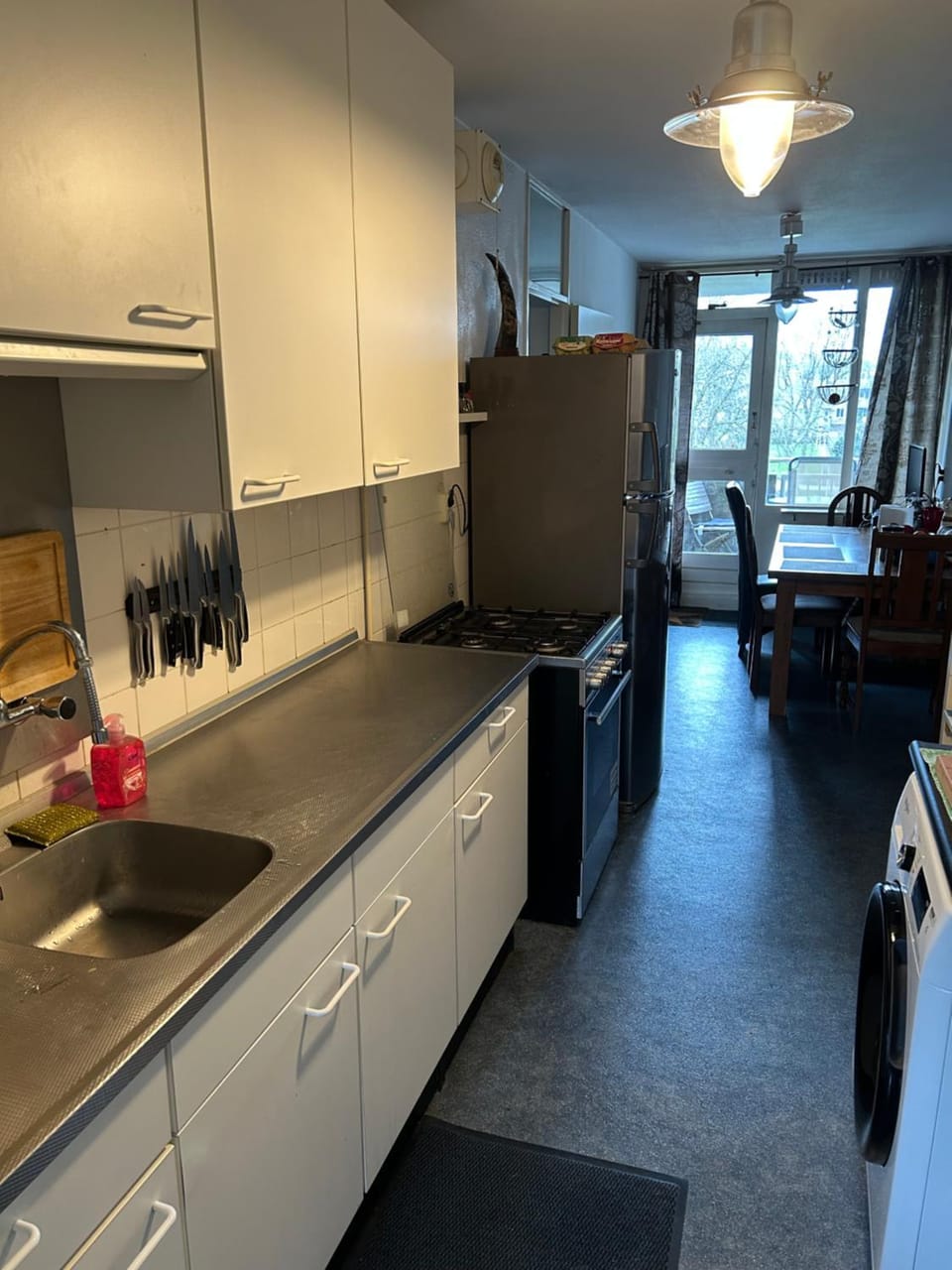 Kitchen or kitchenette, dishwasher, oven, stove