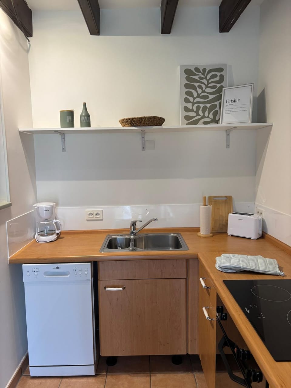 Kitchen or kitchenette, dishwasher, oven, stove