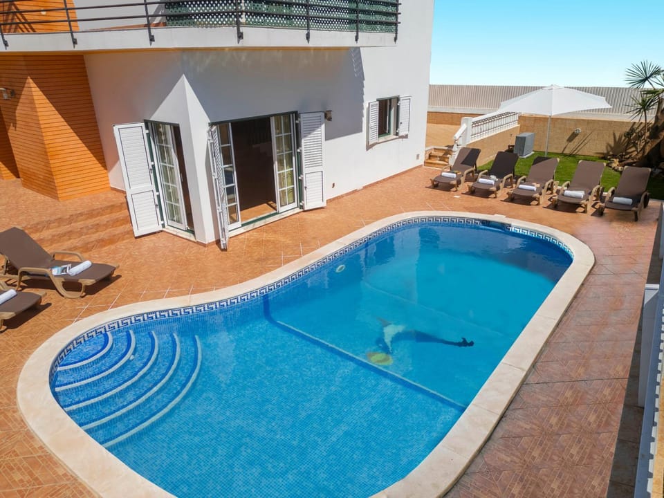 Property building, Patio, Balcony/Terrace, Pool view, Swimming pool, sunbed