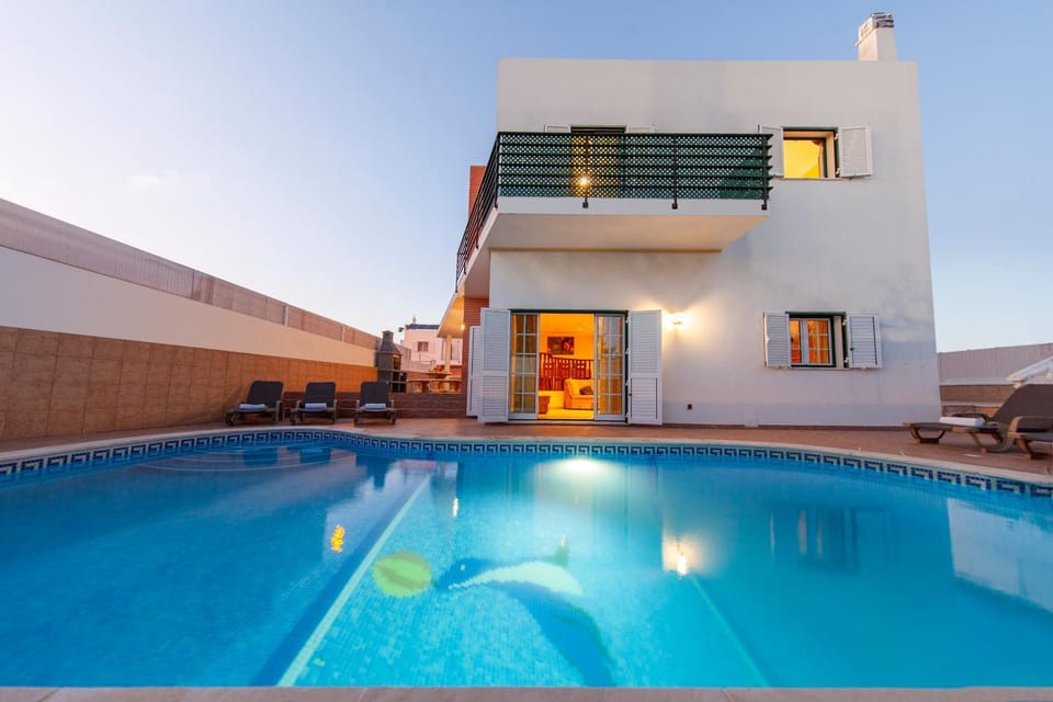 Property building, Patio, Pool view, Swimming pool, sunbed