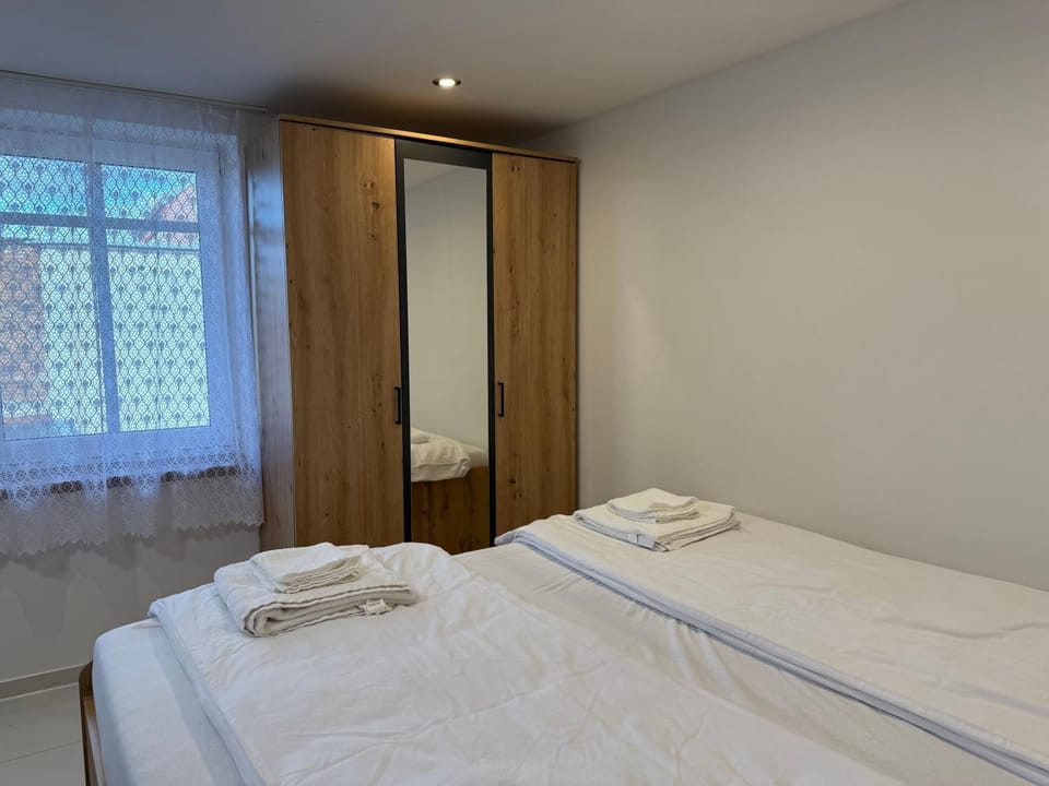 Bed, towels, wardrobe