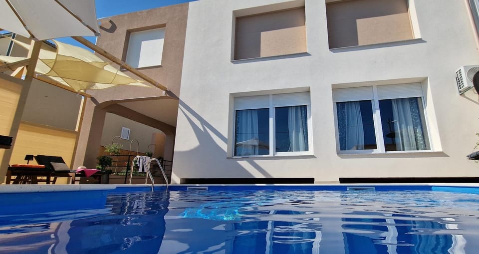 Property building, Patio, Day, View (from property/room), Pool view, Swimming pool, sunbed