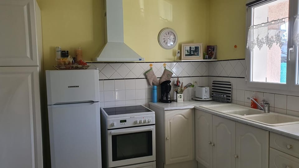 Kitchen or kitchenette, dishwasher, oven, stove, toaster