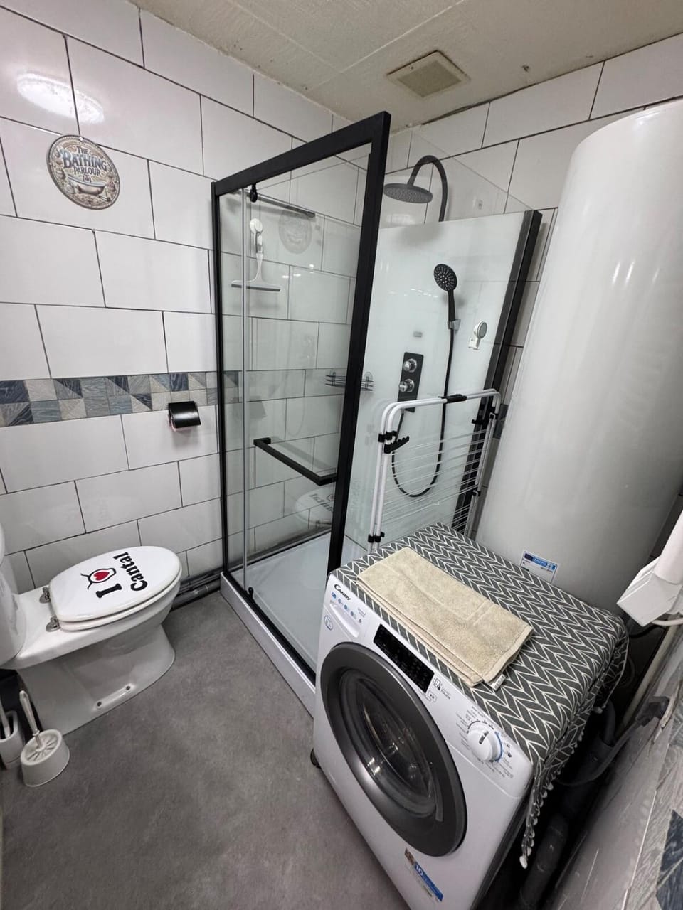 Shower, Toilet, towels, washing machine, dryer