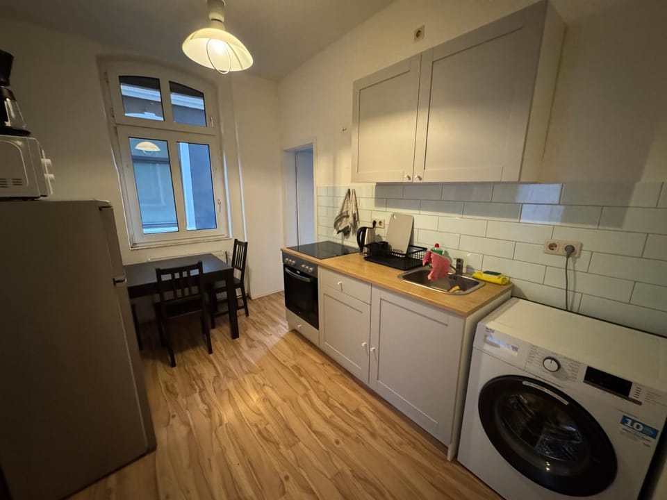 Kitchen or kitchenette, oven, stove, washing machine