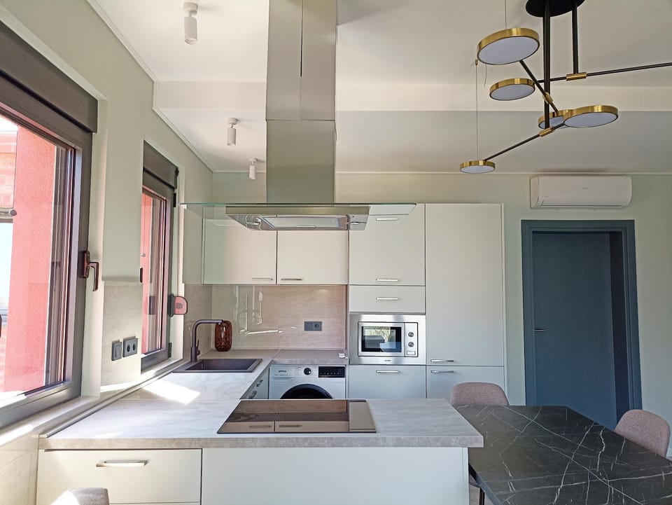Kitchen or kitchenette, dishwasher, oven, stove