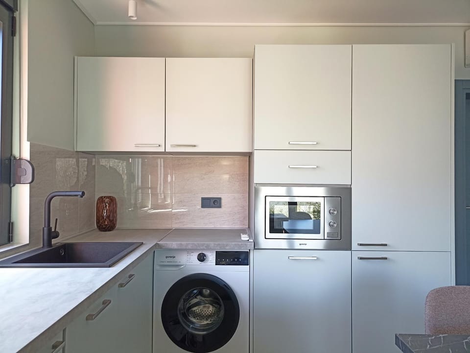 Kitchen or kitchenette, dishwasher, oven, stove, washing machine