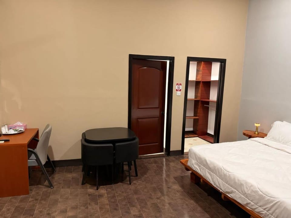 Bed, Seating area, wardrobe