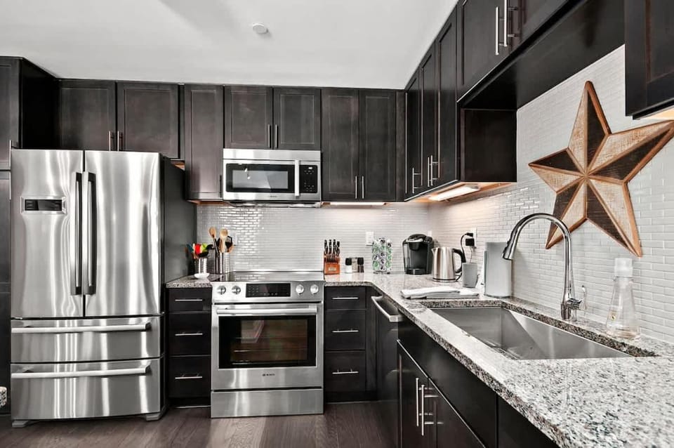 Kitchen or kitchenette, dishwasher, oven, stove