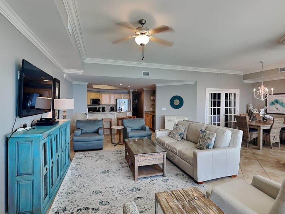 TV and multimedia, Kitchen or kitchenette, Living room, Seating area, Dining area, furniture, microwave, air conditioner