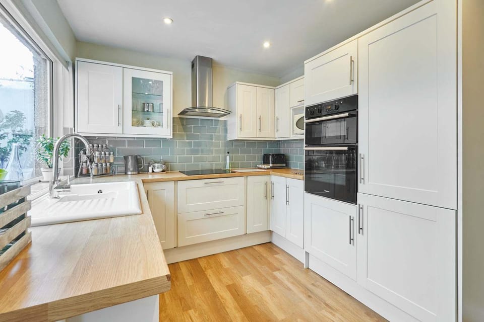 Kitchen or kitchenette, dishwasher, oven, stove, toaster