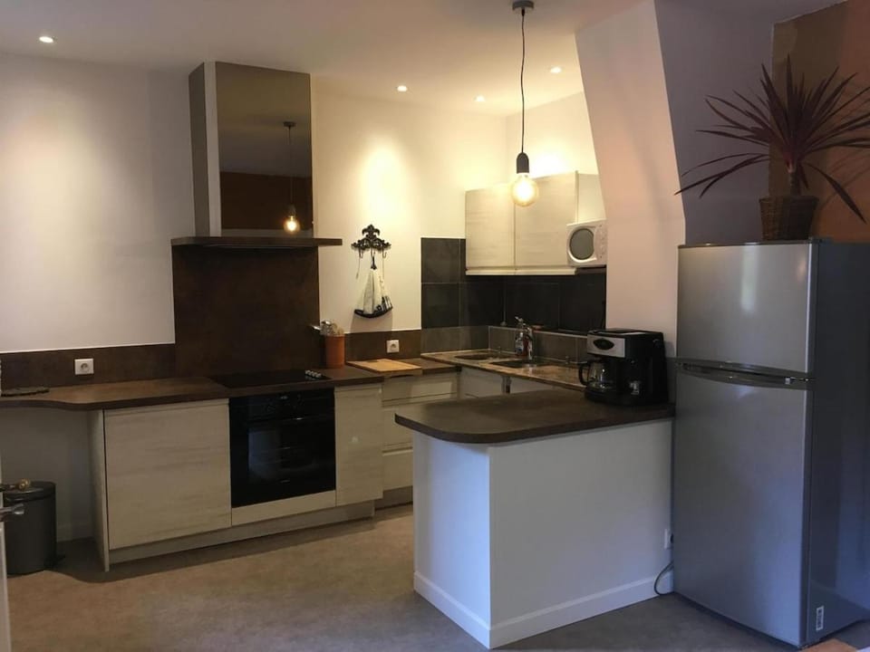Kitchen or kitchenette, dishwasher, oven, stove