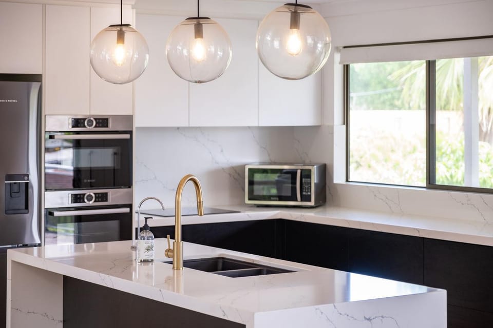 Kitchen or kitchenette, dishwasher, oven, stove