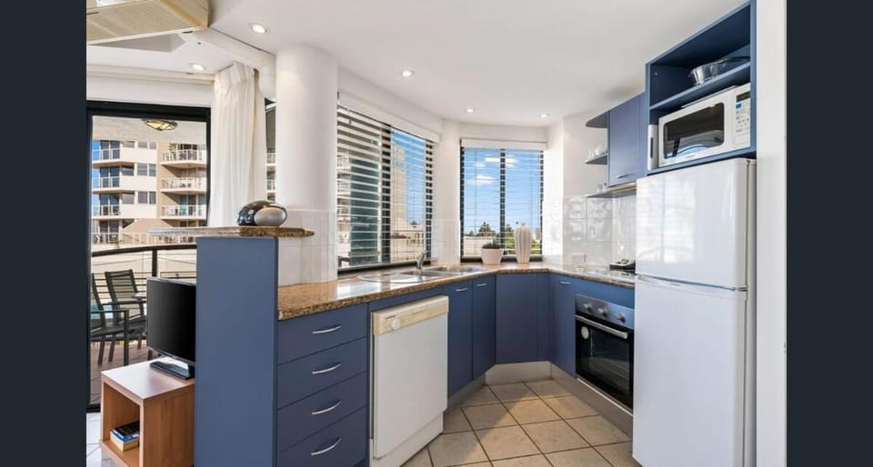 Kitchen or kitchenette, dishwasher, oven, stove